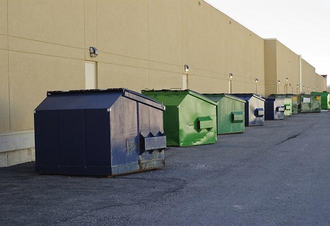 a collection of bright and vibrant dumpsters in a construction zone in Arcadia